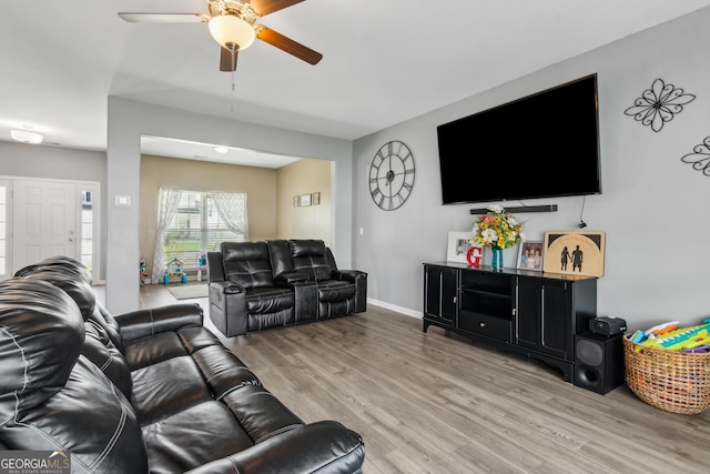 103 Olson Way, Kingsland, GA 31548 - living room with a ceiling fan, light wood finished floors, and baseboards