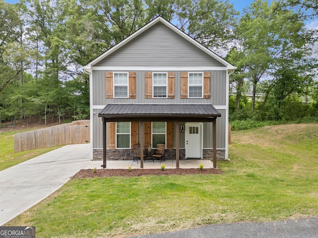 view of front of home with board and batten siding, concrete driveway, and a porch