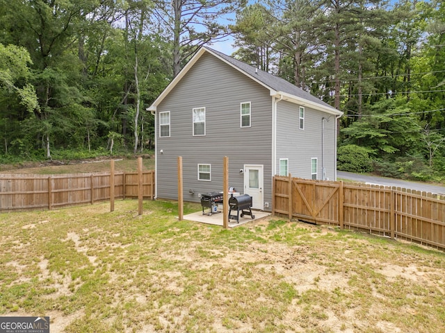 rear view of house with a patio