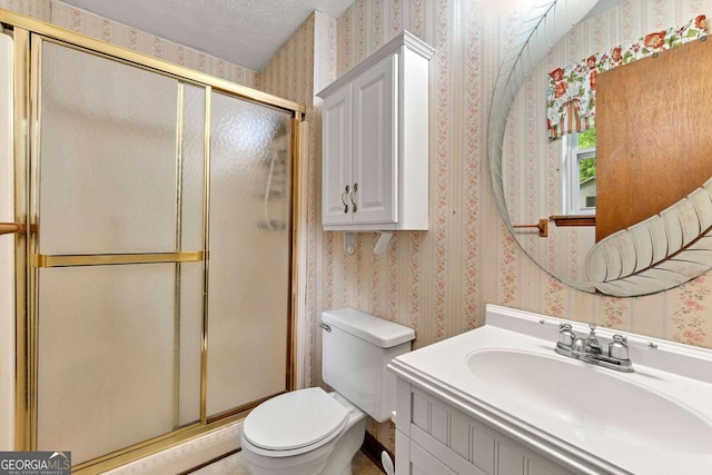 57 Fair Oaks Dr SE, Conyers, GA 30094 - full bath with wallpapered walls, toilet, a shower stall, vanity, and a textured ceiling