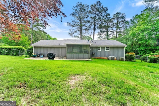 57 Fair Oaks Dr SE, Conyers, GA 30094 - back of house with a sunroom, central air condition unit, and a patio