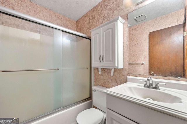 57 Fair Oaks Dr SE, Conyers, GA 30094 - full bath with vanity, enclosed tub / shower combo, toilet, and a textured ceiling
