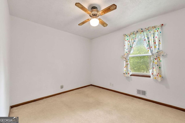 57 Fair Oaks Dr SE, Conyers, GA 30094 - spare room with light carpet, ceiling fan, and baseboards