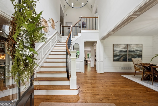 2195 Hickory Hill Rd, Alpharetta, GA 30004 - staircase with wood finished floors and a towering ceiling