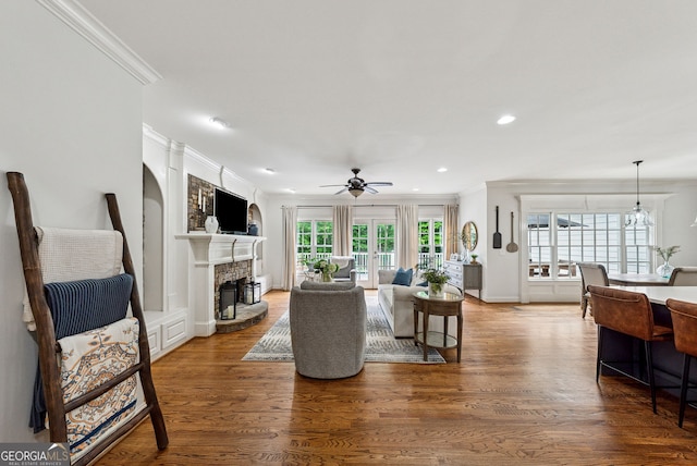 2195 Hickory Hill Rd, Alpharetta, GA 30004 - living room with crown molding, ceiling fan, wood finished floors, a fireplace, and recessed lighting