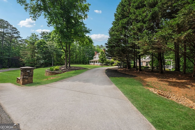 2195 Hickory Hill Rd, Alpharetta, GA 30004 - view of community with a lawn and driveway