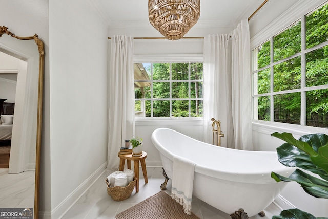 2195 Hickory Hill Rd, Alpharetta, GA 30004 - bathroom featuring a freestanding tub, crown molding, baseboards, and a chandelier
