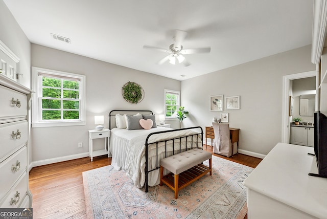 2195 Hickory Hill Rd, Alpharetta, GA 30004 - bedroom featuring light wood-style flooring, baseboards, and a ceiling fan