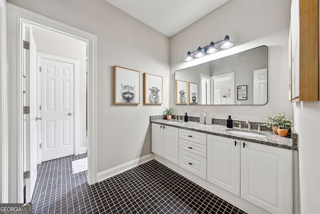2195 Hickory Hill Rd, Alpharetta, GA 30004 - bathroom featuring double vanity, tile patterned flooring, and baseboards