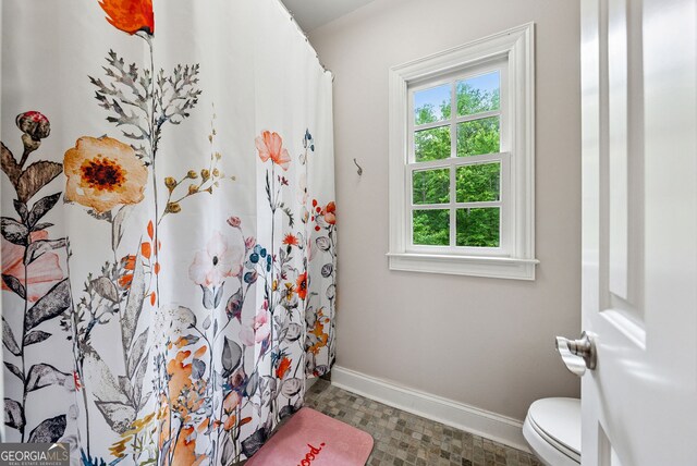 2195 Hickory Hill Rd, Alpharetta, GA 30004 - full bath with plenty of natural light, baseboards, toilet, and a shower with shower curtain