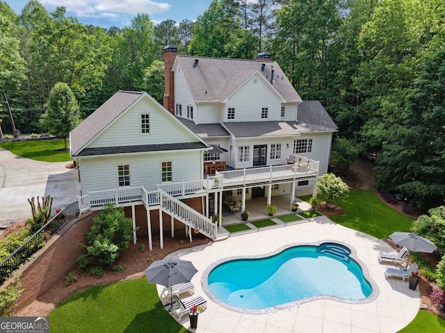 2195 Hickory Hill Rd, Alpharetta, GA 30004 - back of property with stairway, a wooden deck, a patio, and a yard