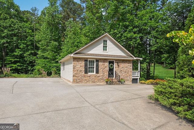 2195 Hickory Hill Rd, Alpharetta, GA 30004 - view of front of house with stone siding and driveway