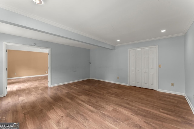 1713 Dudley Dr, Woodstock, GA 30188 - unfurnished bedroom featuring ornamental molding, wood finished floors, a closet, and recessed lighting