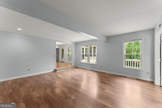 1713 Dudley Dr, Woodstock, GA 30188 - empty room with wood finished floors and recessed lighting