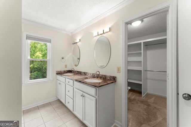 1713 Dudley Dr, Woodstock, GA 30188 - full bathroom with a textured ceiling, double vanity, ornamental molding, tile patterned flooring, and a spacious closet