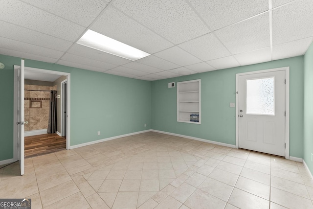 1713 Dudley Dr, Woodstock, GA 30188 - entrance foyer with light tile patterned flooring and a paneled ceiling