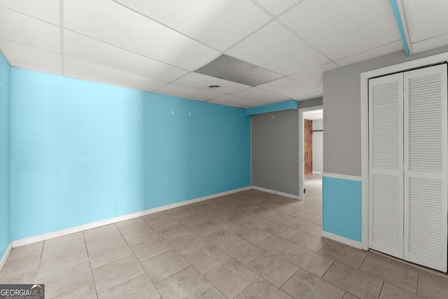 1713 Dudley Dr, Woodstock, GA 30188 - empty room with a paneled ceiling and tile patterned floors