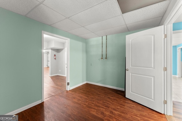 1713 Dudley Dr, Woodstock, GA 30188 - unfurnished room with a drop ceiling and wood finished floors