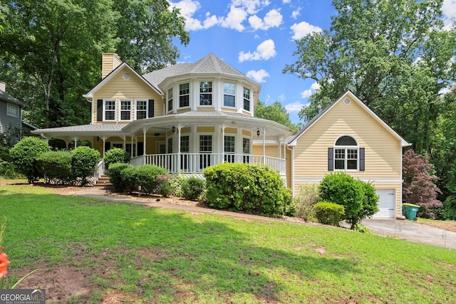 1713 Dudley Dr, Woodstock, GA 30188 - victorian house with covered porch, a front yard, a chimney, and a garage