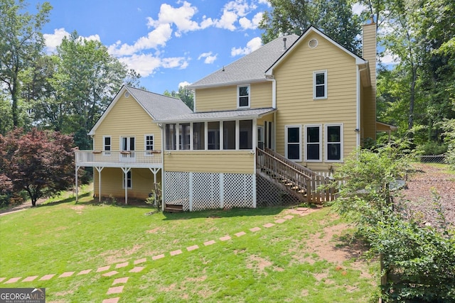 1713 Dudley Dr, Woodstock, GA 30188 - rear view of house featuring a sunroom, a chimney, a yard, stairs, and roof with shingles