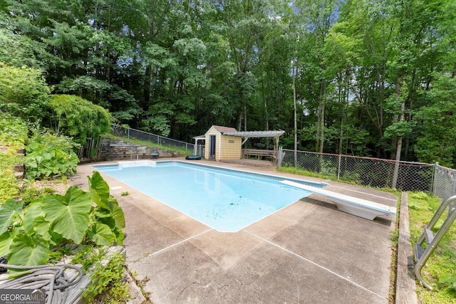 1713 Dudley Dr, Woodstock, GA 30188 - view of swimming pool with an outbuilding and a diving board