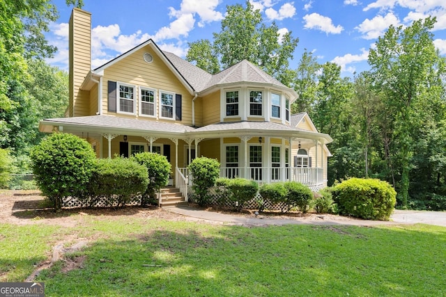 1713 Dudley Dr, Woodstock, GA 30188 - victorian house featuring a chimney, a porch, and a front lawn