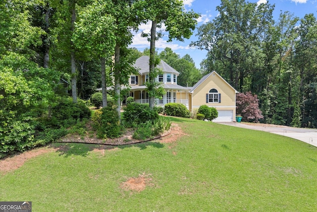 1713 Dudley Dr, Woodstock, GA 30188 - view of front facade with driveway, a garage, a front lawn, and covered porch