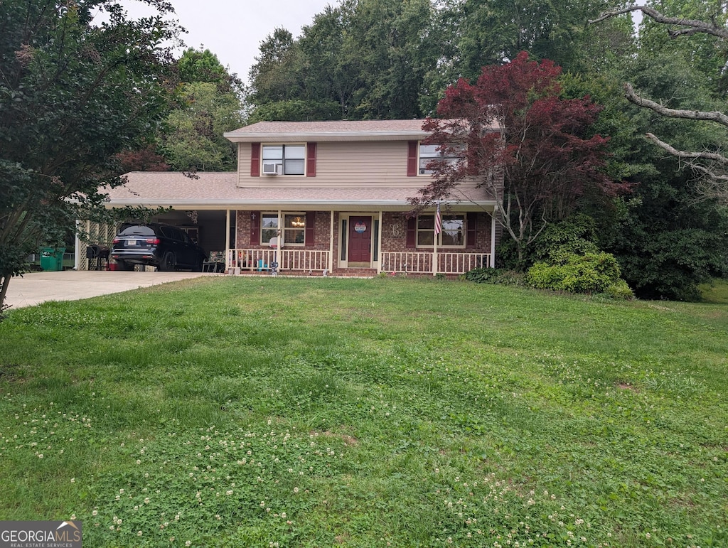 135 Country View Dr, Eastanollee, GA 30538 - traditional home featuring driveway, a porch, a carport, and a front yard