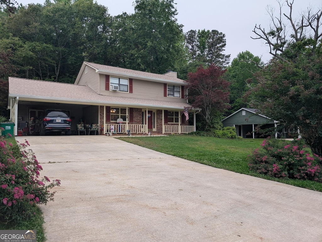 135 Country View Dr, Eastanollee, GA 30538 - traditional-style home featuring covered porch, concrete driveway, a front lawn, and a chimney