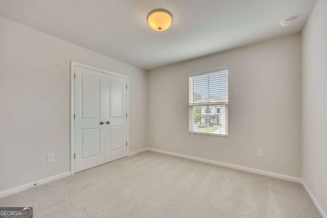 165 Brookstone Park E, Acworth, GA 30101 - unfurnished bedroom featuring light carpet and baseboards