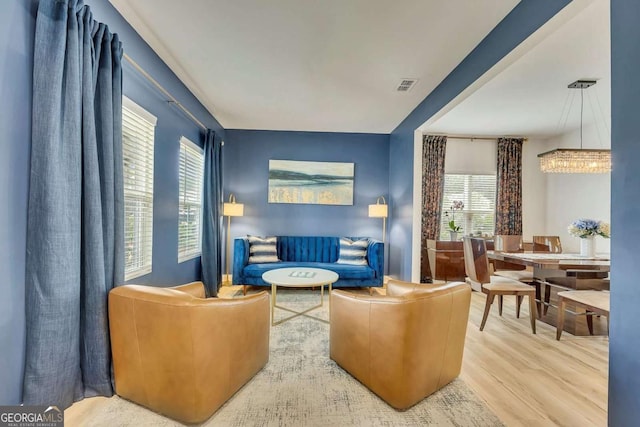 165 Brookstone Park E, Acworth, GA 30101 - living room featuring wood finished floors and a chandelier