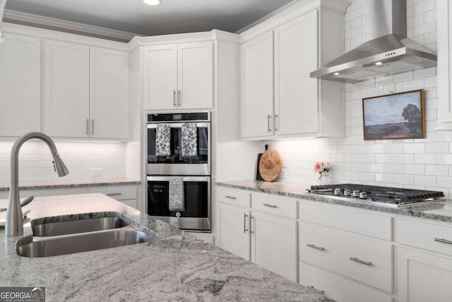 6840 Canyon Creek Way, Cumming, GA 30028 - kitchen with wall chimney exhaust hood, appliances with stainless steel finishes, white cabinets, backsplash, and recessed lighting