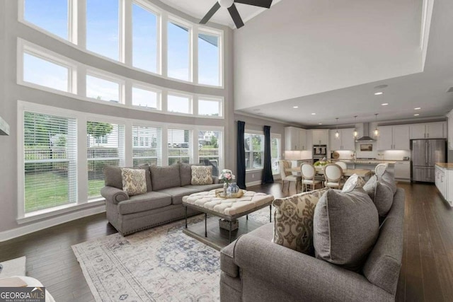6840 Canyon Creek Way, Cumming, GA 30028 - living area featuring a towering ceiling, dark wood-style flooring, and a ceiling fan