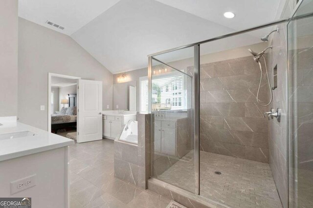 6840 Canyon Creek Way, Cumming, GA 30028 - ensuite bathroom featuring vanity, vaulted ceiling, a shower stall, a bath, and recessed lighting