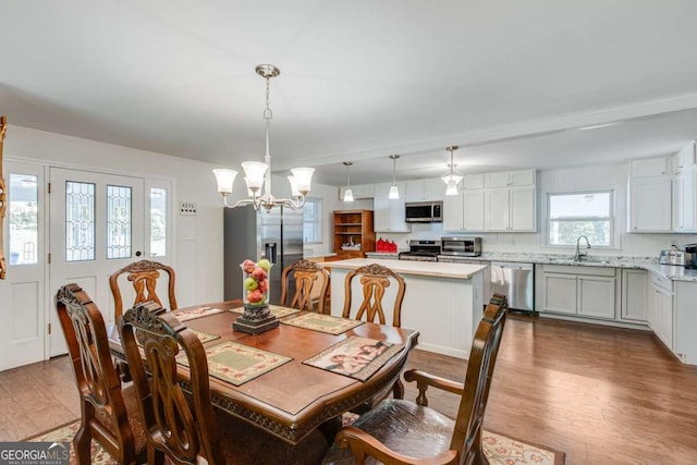 dining area featuring a chandelier and dark wood-type flooring