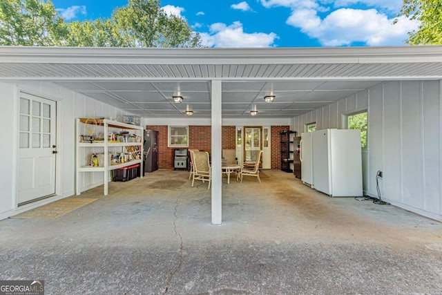 view of parking with an attached carport