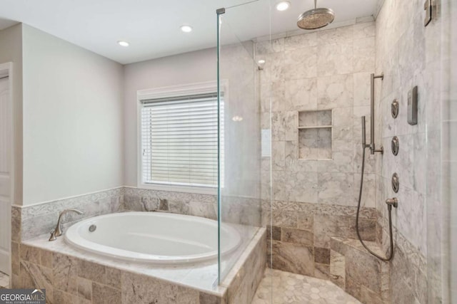 5655 Stevehaven Ln, Cumming, GA 30028 - bathroom featuring a bath, a shower stall, and recessed lighting