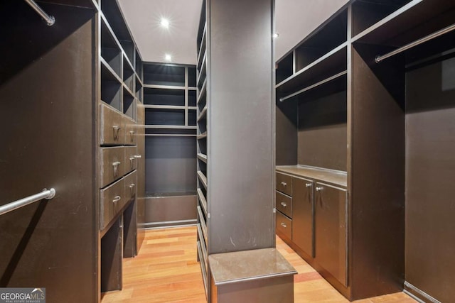 5655 Stevehaven Ln, Cumming, GA 30028 - walk in closet with light wood-type flooring