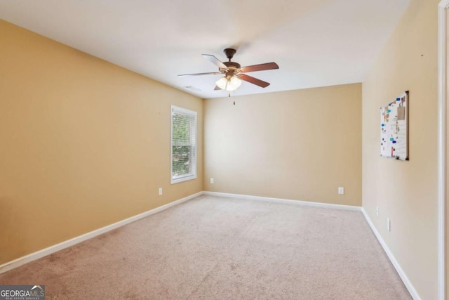 5655 Stevehaven Ln, Cumming, GA 30028 - empty room with ceiling fan, carpet floors, and baseboards