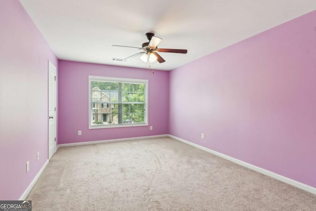 5655 Stevehaven Ln, Cumming, GA 30028 - empty room featuring a ceiling fan, carpet floors, and baseboards