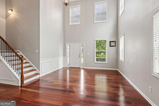 5655 Stevehaven Ln, Cumming, GA 30028 - foyer entrance featuring hardwood / wood-style flooring, stairs, a high ceiling, and baseboards
