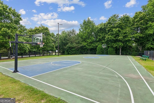 5655 Stevehaven Ln, Cumming, GA 30028 - view of sport court with community basketball court, fence, and view of scattered trees