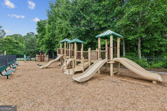 5655 Stevehaven Ln, Cumming, GA 30028 - communal playground featuring fence and view of scattered trees