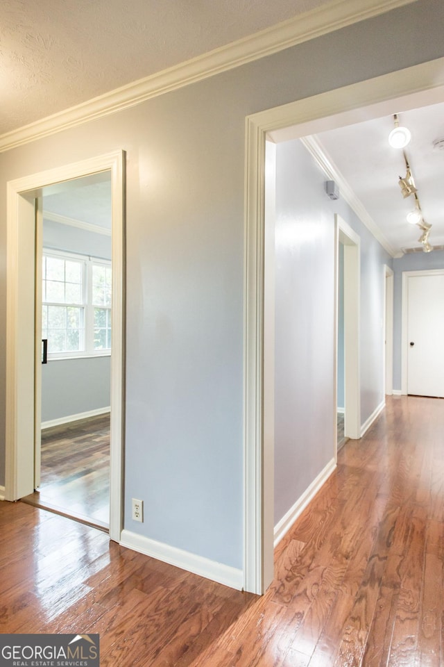 1878 Blalock Ave, Waycross, GA 31503 - hallway with crown molding, wood finished floors, and baseboards