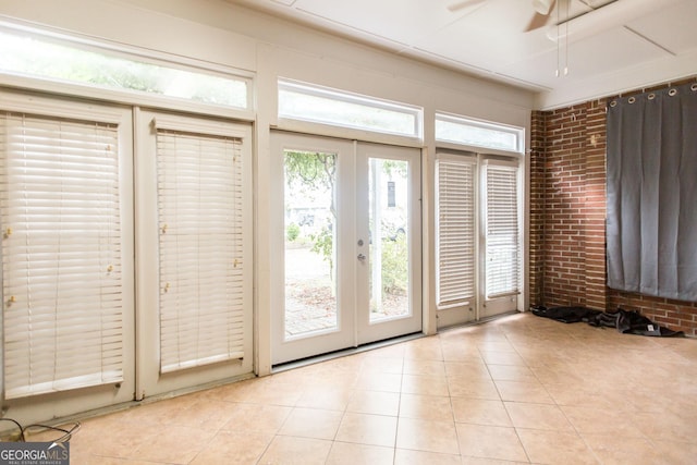 1878 Blalock Ave, Waycross, GA 31503 - doorway with light tile patterned flooring, a ceiling fan, french doors, and brick wall