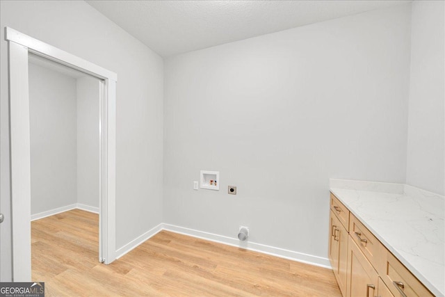 1186 Snow Hill Rd, Cadwell, GA 31009 - washroom with electric dryer hookup, washer hookup, light wood-style floors, and baseboards