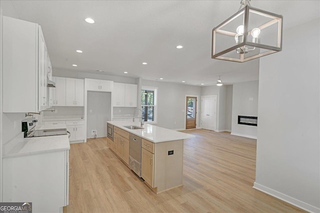 1186 Snow Hill Rd, Cadwell, GA 31009 - kitchen with a sink, stainless steel appliances, light wood-style flooring, baseboards, and recessed lighting