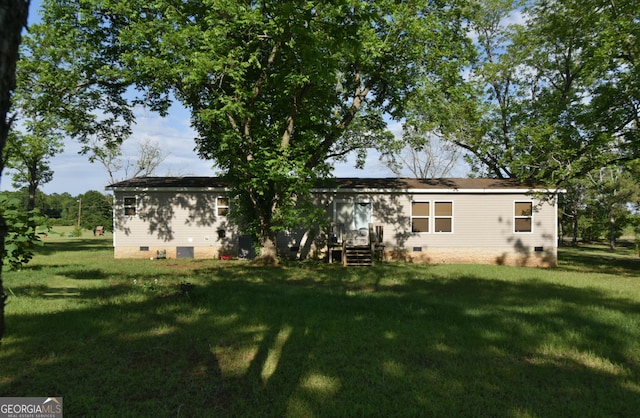 164 Livingston Rd, Smithville, GA 31787 - back of property featuring crawl space and a yard
