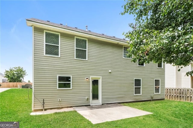 back of house with a patio
