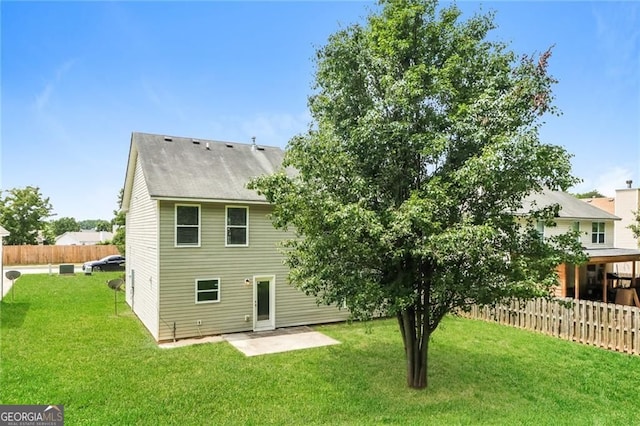 rear view of property featuring a patio